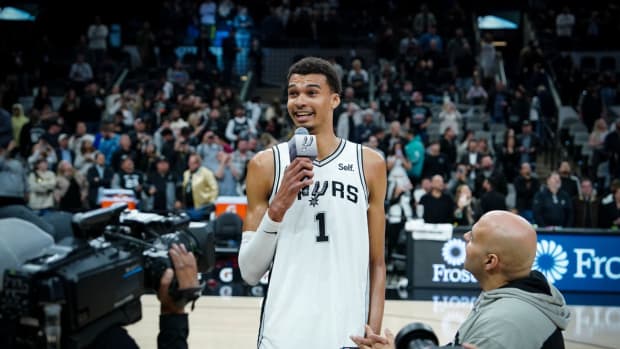 Feb 29, 2024; San Antonio, Texas, USA; San Antonio Spurs center Victor Wembanyama (1) speaks to the fans after a win over the Oklahoma City Thunder at Frost Bank Center. 